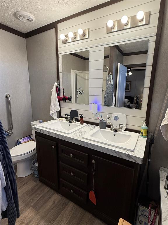 12703 Farm To Market 59 Athens, TX 75751 - Photo 31 of 40 a bathroom with a double vanity sink and a mirror