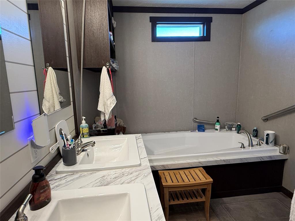 12703 Farm To Market 59 Athens, TX 75751 - Photo 32 of 40 a bathroom with a sink and a mirror