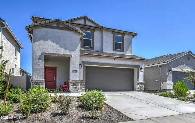 front view of a house with a yard