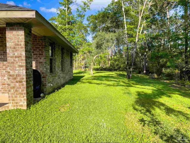 a view of a back yard of the house