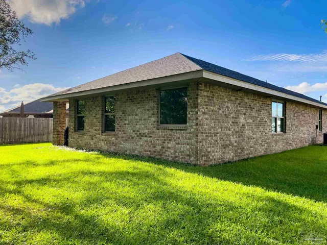 a backyard of a house with lots of green space