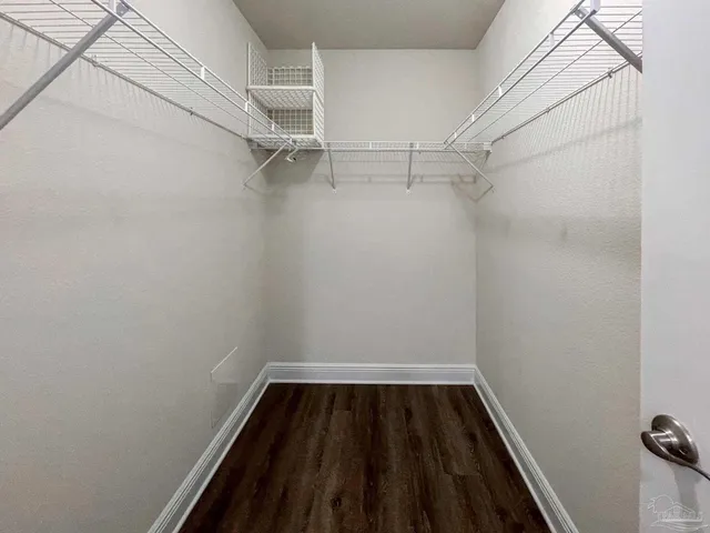 a view of a room with racks on the wall