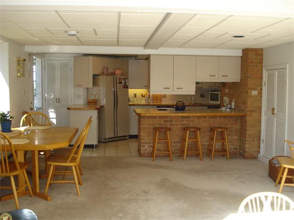 10 Pickerel Road Wellesley, MA 01760 - Photo 14 of 22 a dining hall with stainless steel appliances granite countertop a dining table and chairs