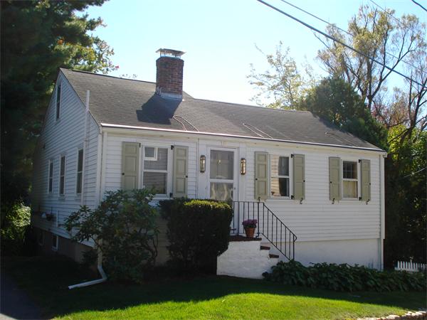 10 Pickerel Road Wellesley, MA 01760 - Photo 7 of 22 a front view of a house with garden