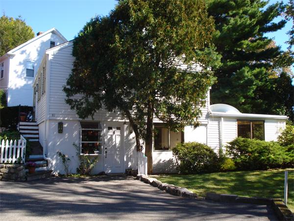 10 Pickerel Road Wellesley, MA 01760 - Photo 8 of 22 a front view of a house with a yard