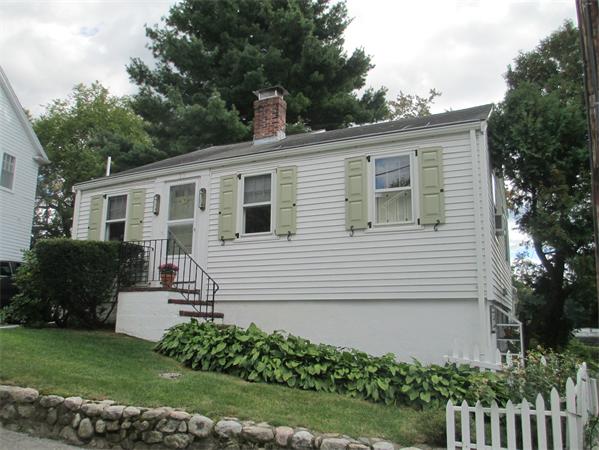 10 Pickerel Road Wellesley, MA 01760 - Photo 9 of 22 a front view of a house with a garden