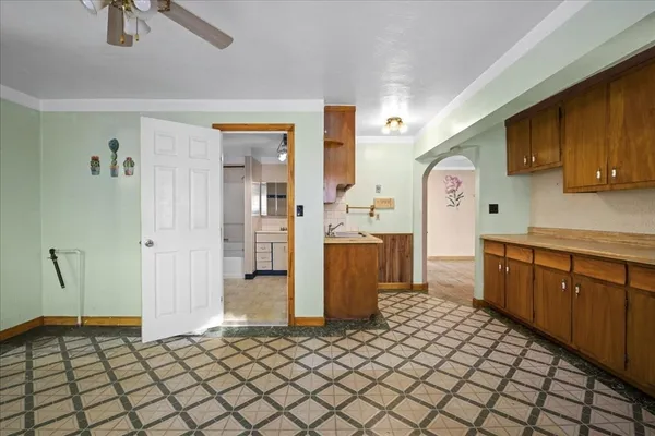 a kitchen with a sink cabinets and appliances