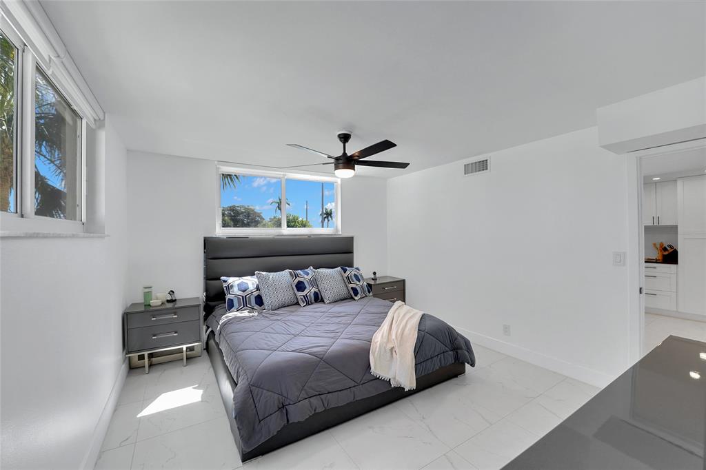 8911 South Hollybrook Boulevard, Unit 201 Pembroke Pines, FL 33025 - Photo 16 of 31 a bedroom with a bed and window