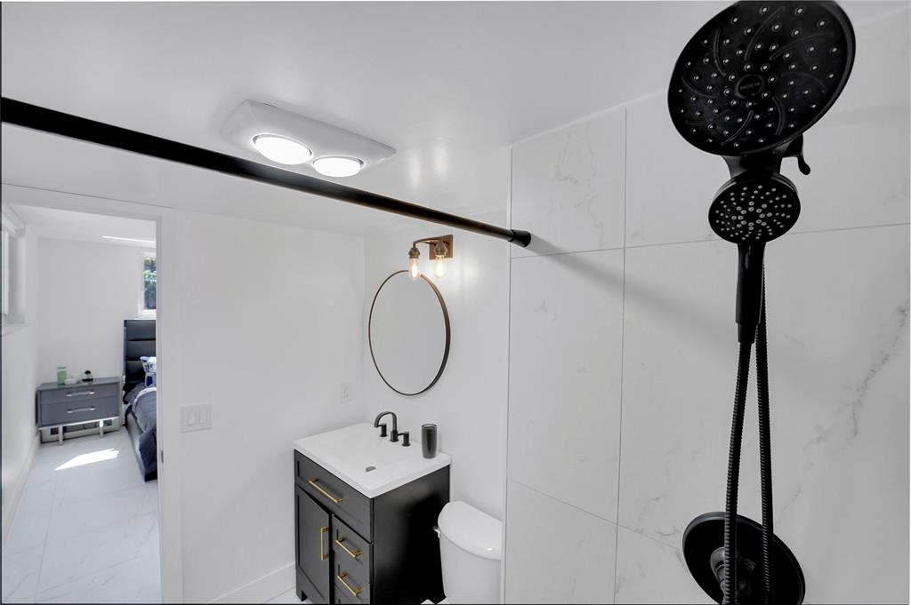 8911 South Hollybrook Boulevard, Unit 201 Pembroke Pines, FL 33025 - Photo 18 of 31 a room with a table and a chandelier