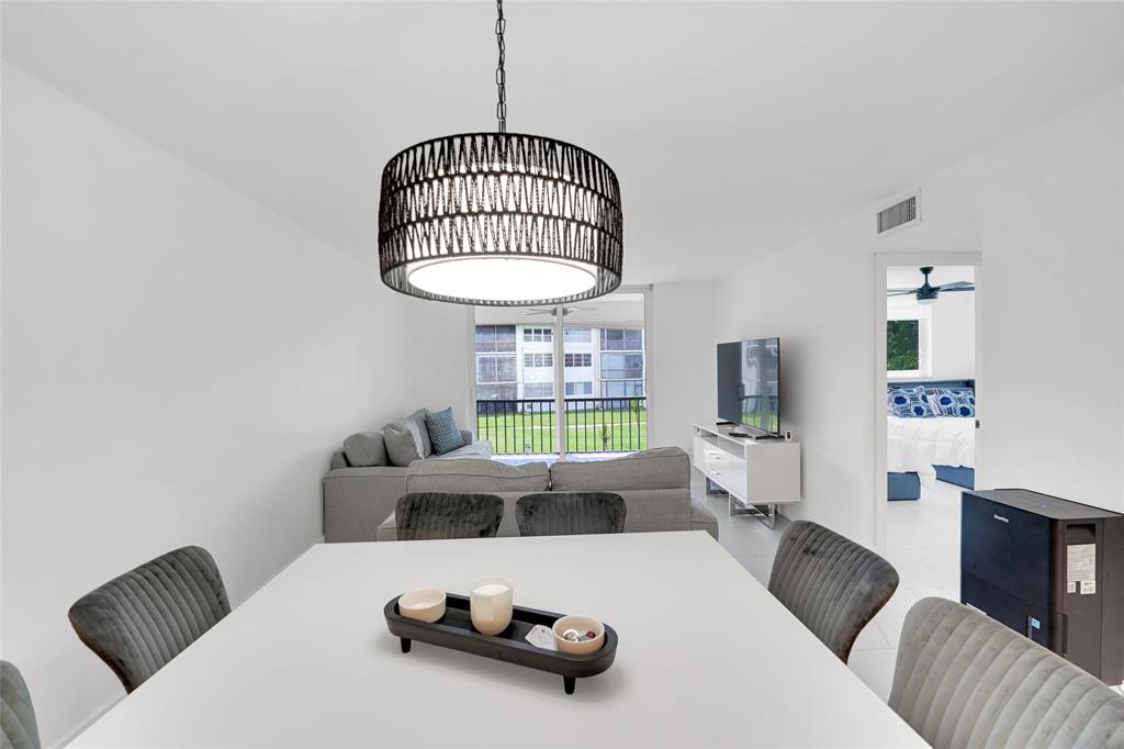 8911 South Hollybrook Boulevard, Unit 201 Pembroke Pines, FL 33025 - Photo 8 of 31 a living room with furniture and a window