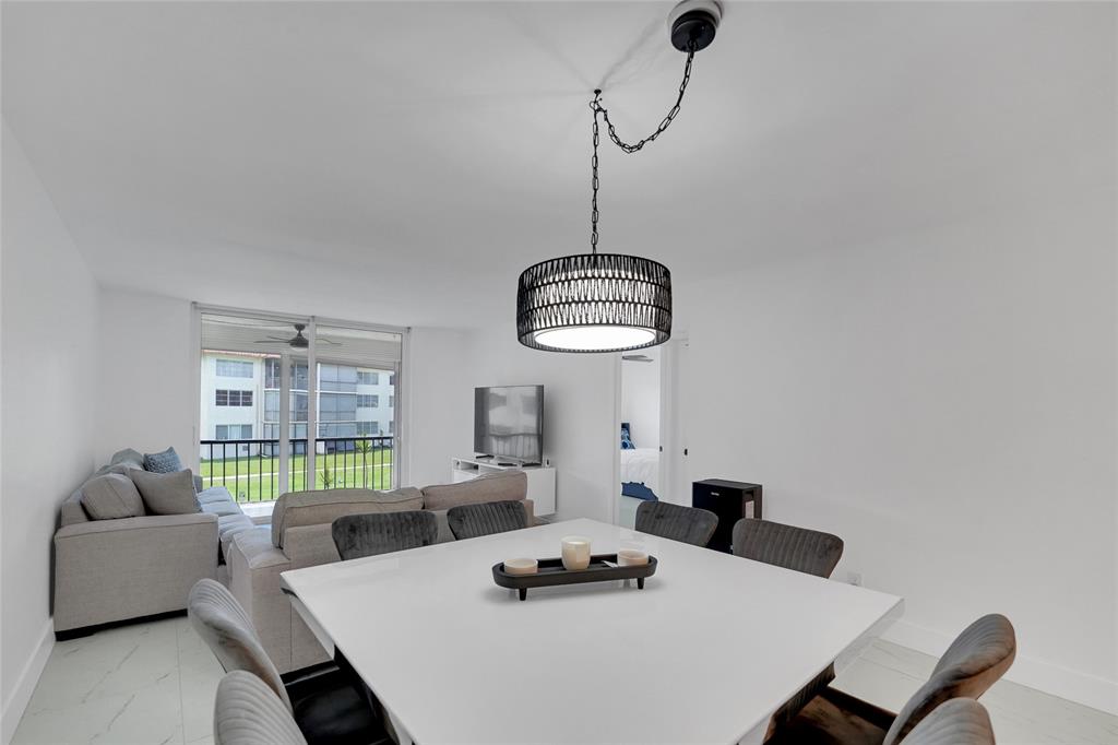 8911 South Hollybrook Boulevard, Unit 201 Pembroke Pines, FL 33025 - Photo 10 of 31 a living room with furniture and a window