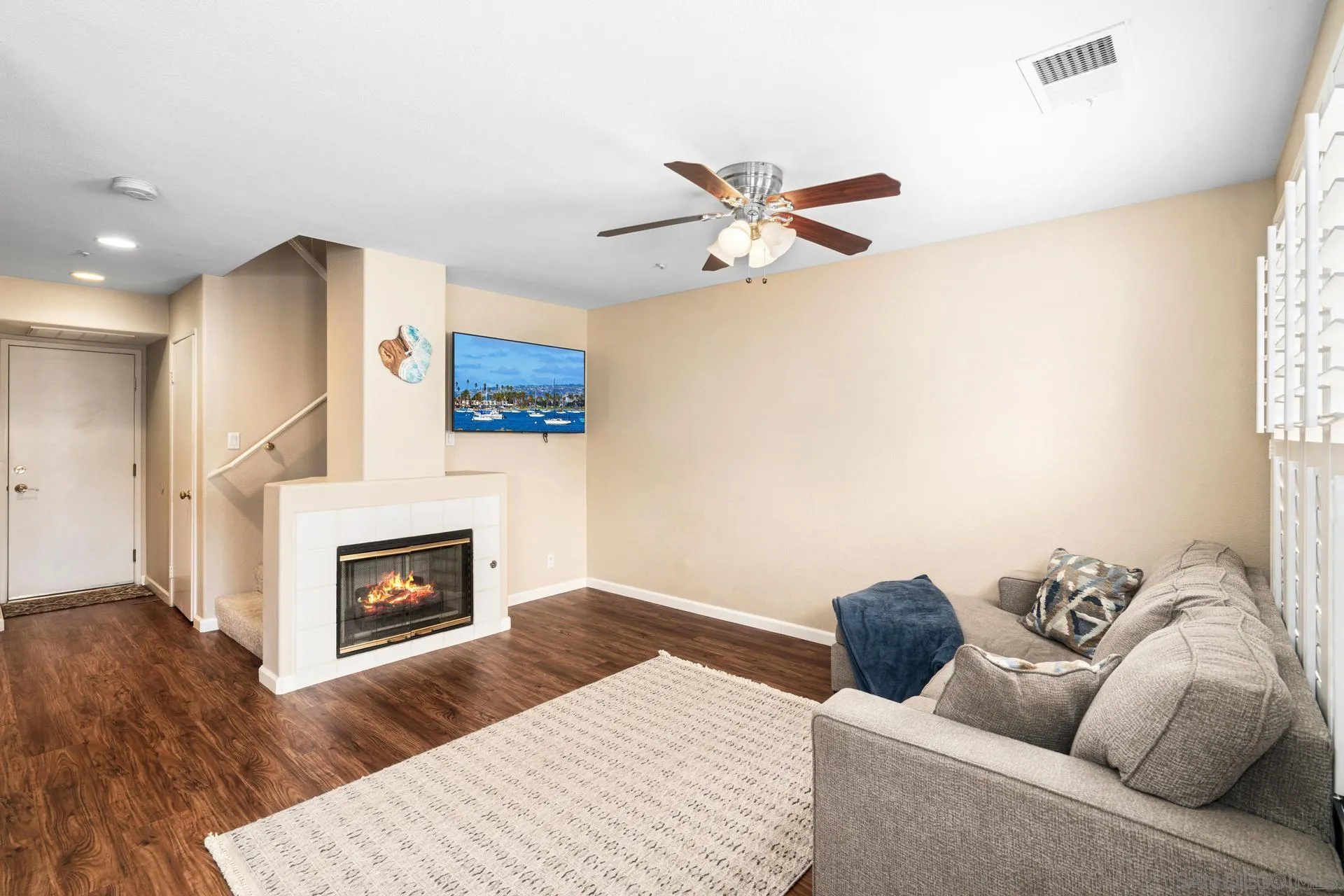 405 Whispering Willow Drive, Unit C Santee, CA 92071 - Photo 11 of 39 a living room with furniture and a fireplace