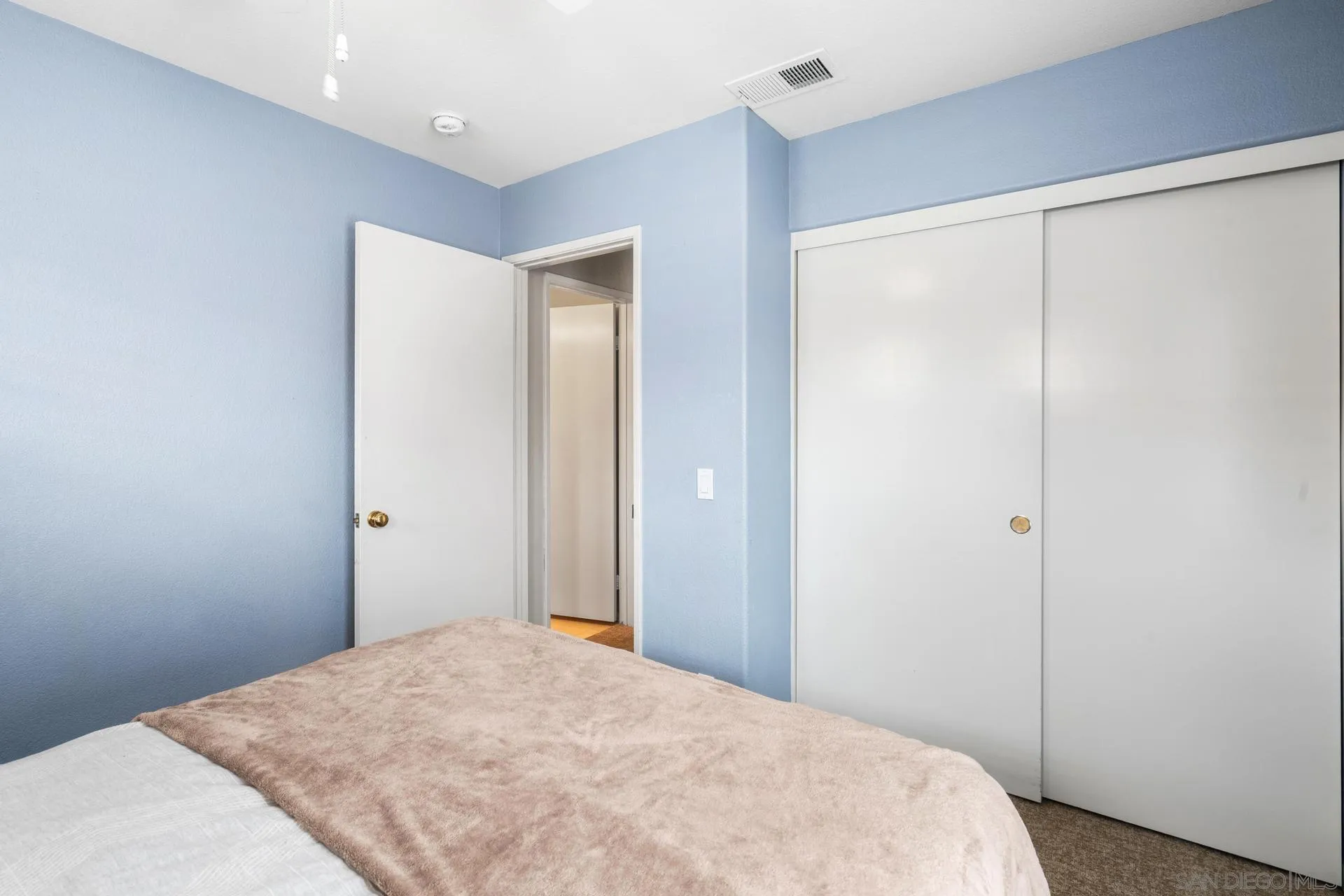 405 Whispering Willow Drive, Unit C Santee, CA 92071 - Photo 16 of 39 a bedroom with a bed and a window