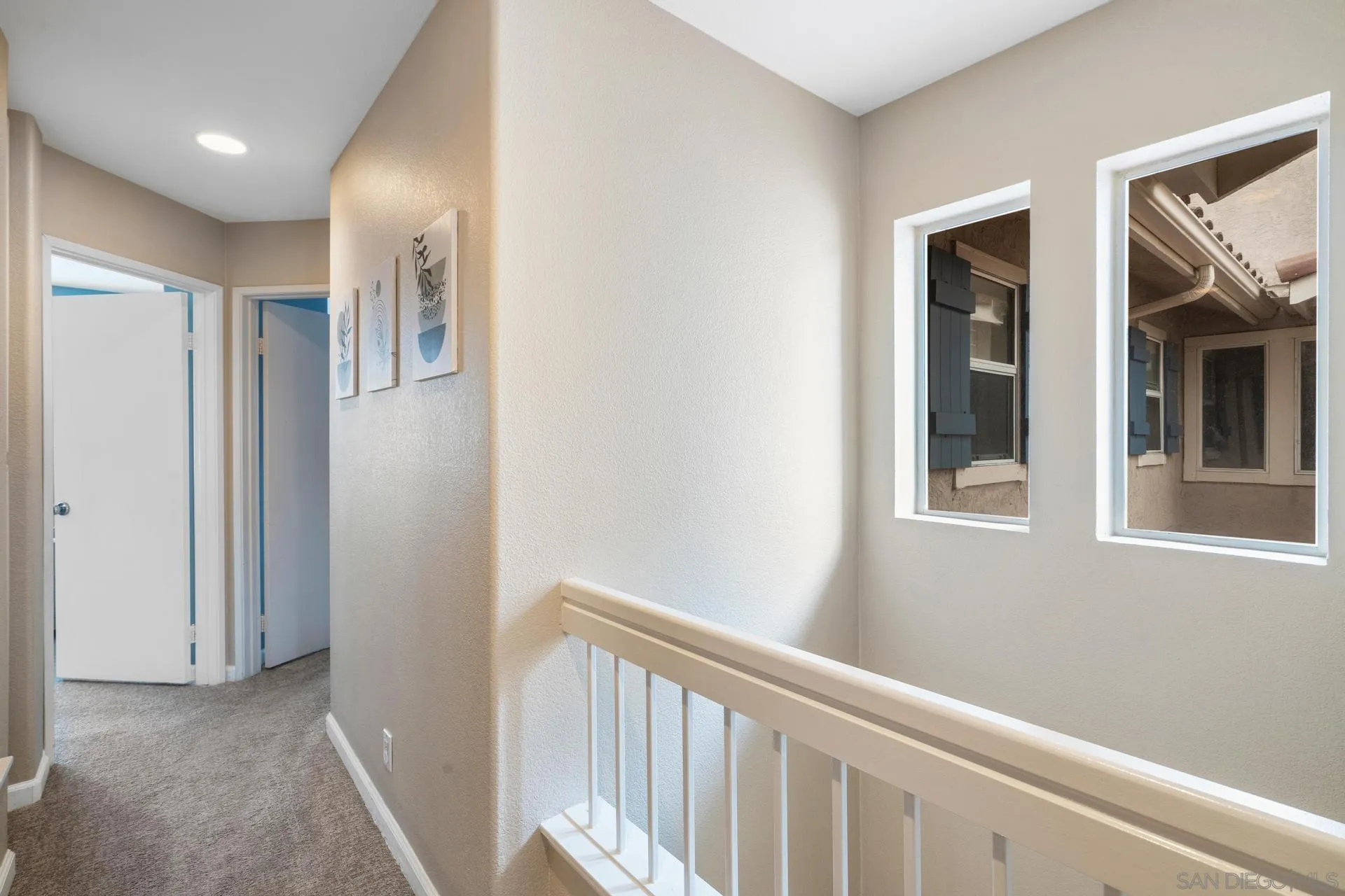 405 Whispering Willow Drive, Unit C Santee, CA 92071 - Photo 18 of 39 a view of a hallway with windows