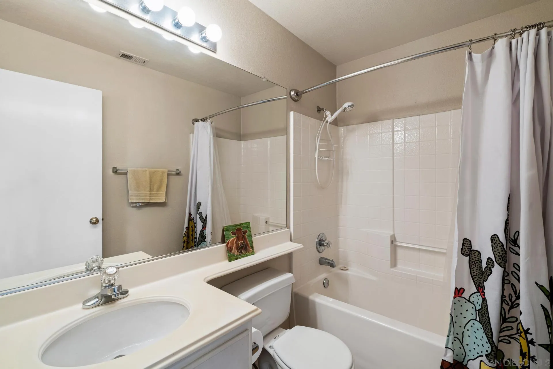 405 Whispering Willow Drive, Unit C Santee, CA 92071 - Photo 21 of 39 a bathroom with a sink toilet tub and shower
