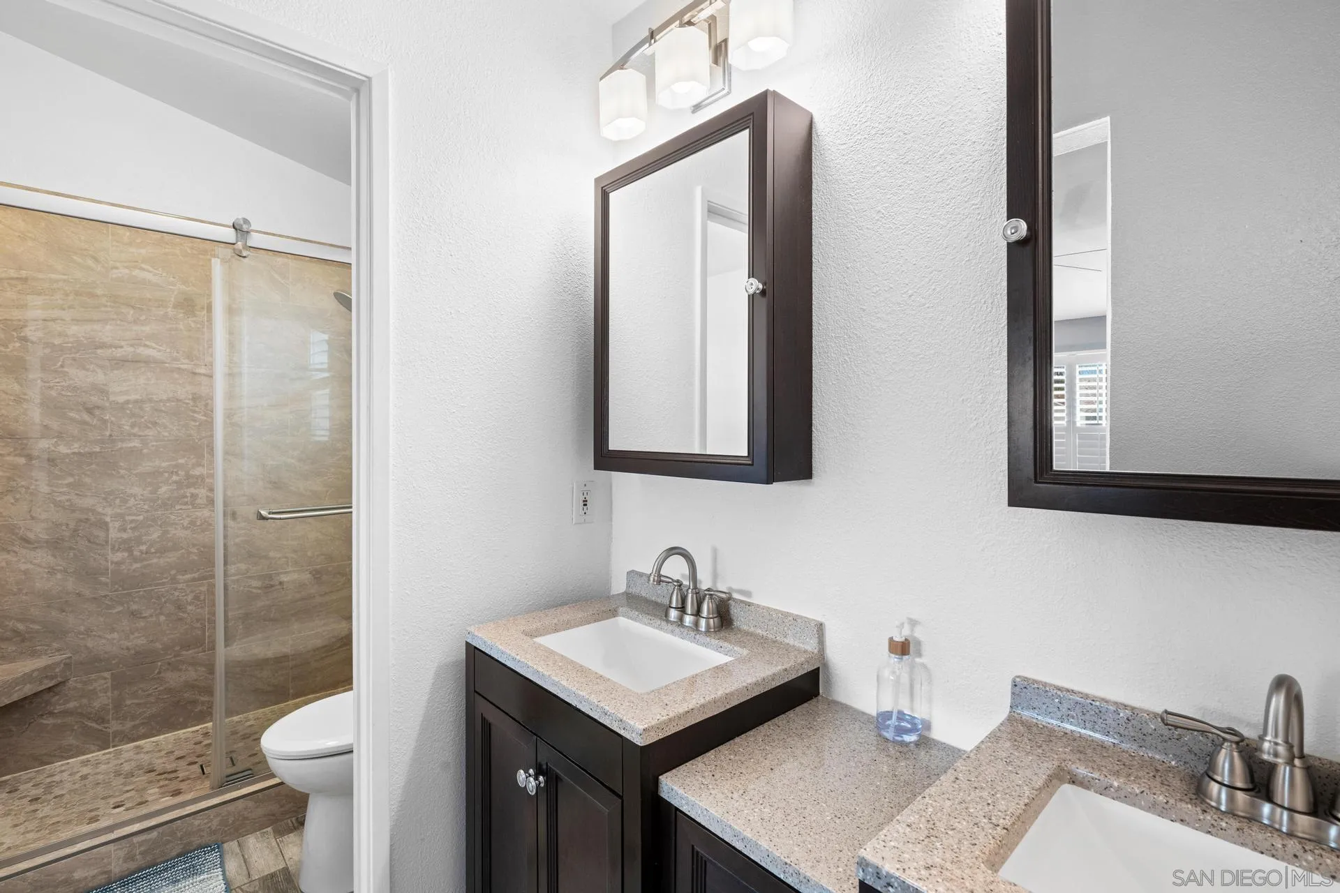 405 Whispering Willow Drive, Unit C Santee, CA 92071 - Photo 22 of 39 a bathroom with a sink toilet and shower