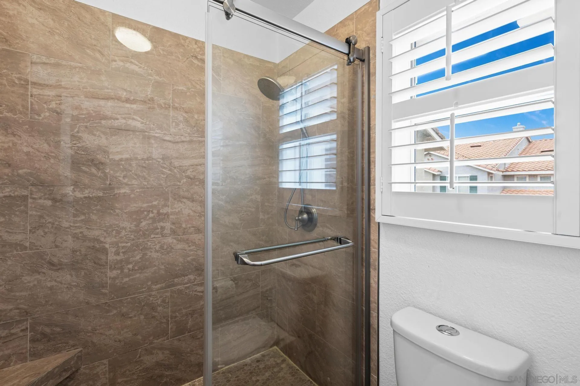 405 Whispering Willow Drive, Unit C Santee, CA 92071 - Photo 23 of 39 a bathroom with a window and a shower