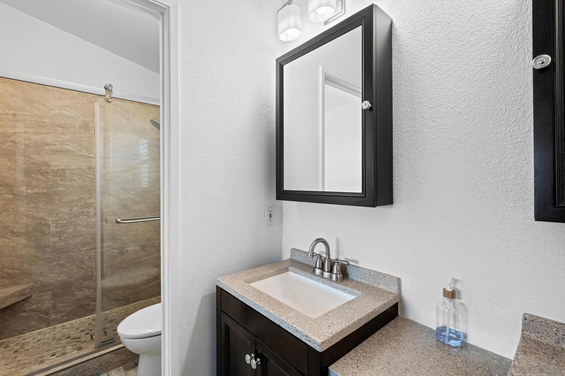 405 Whispering Willow Drive, Unit C Santee, CA 92071 - Photo 25 of 39 a bathroom with a sink a toilet and shower