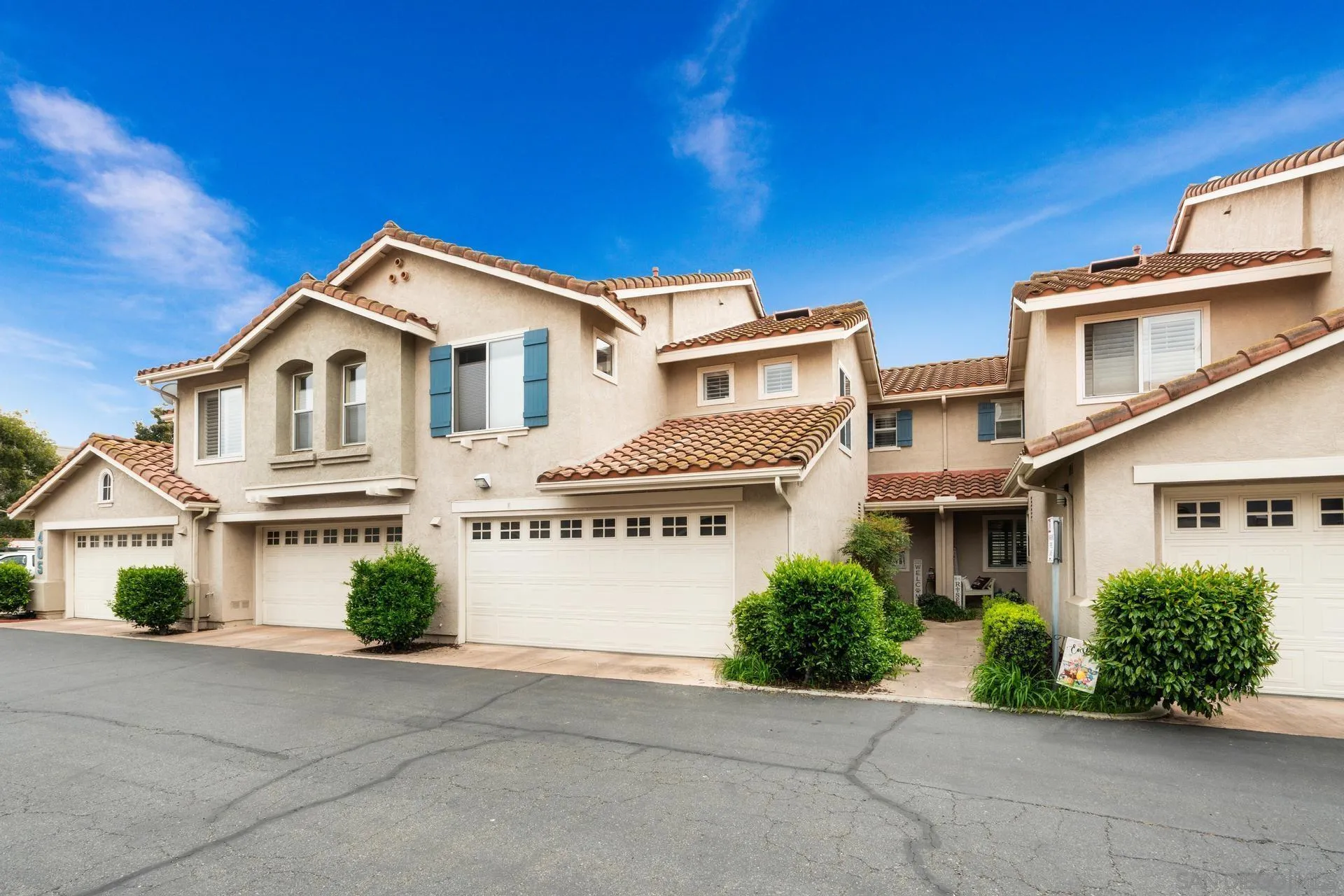 405 Whispering Willow Drive, Unit C Santee, CA 92071 - Photo 36 of 39 a front view of a house with a yard