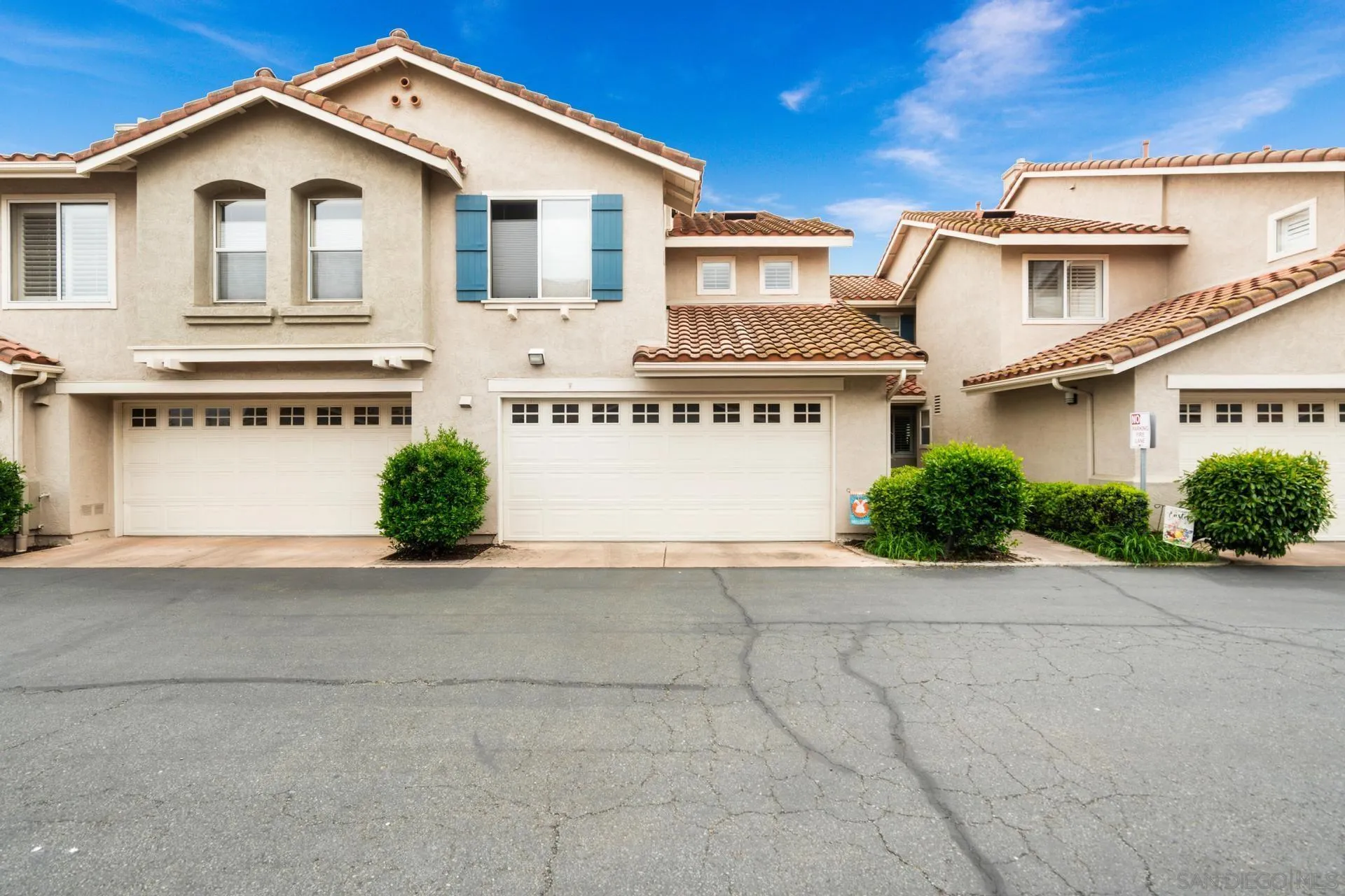 405 Whispering Willow Drive, Unit C Santee, CA 92071 - Photo 37 of 39 a view of white house with a yard and potted plants