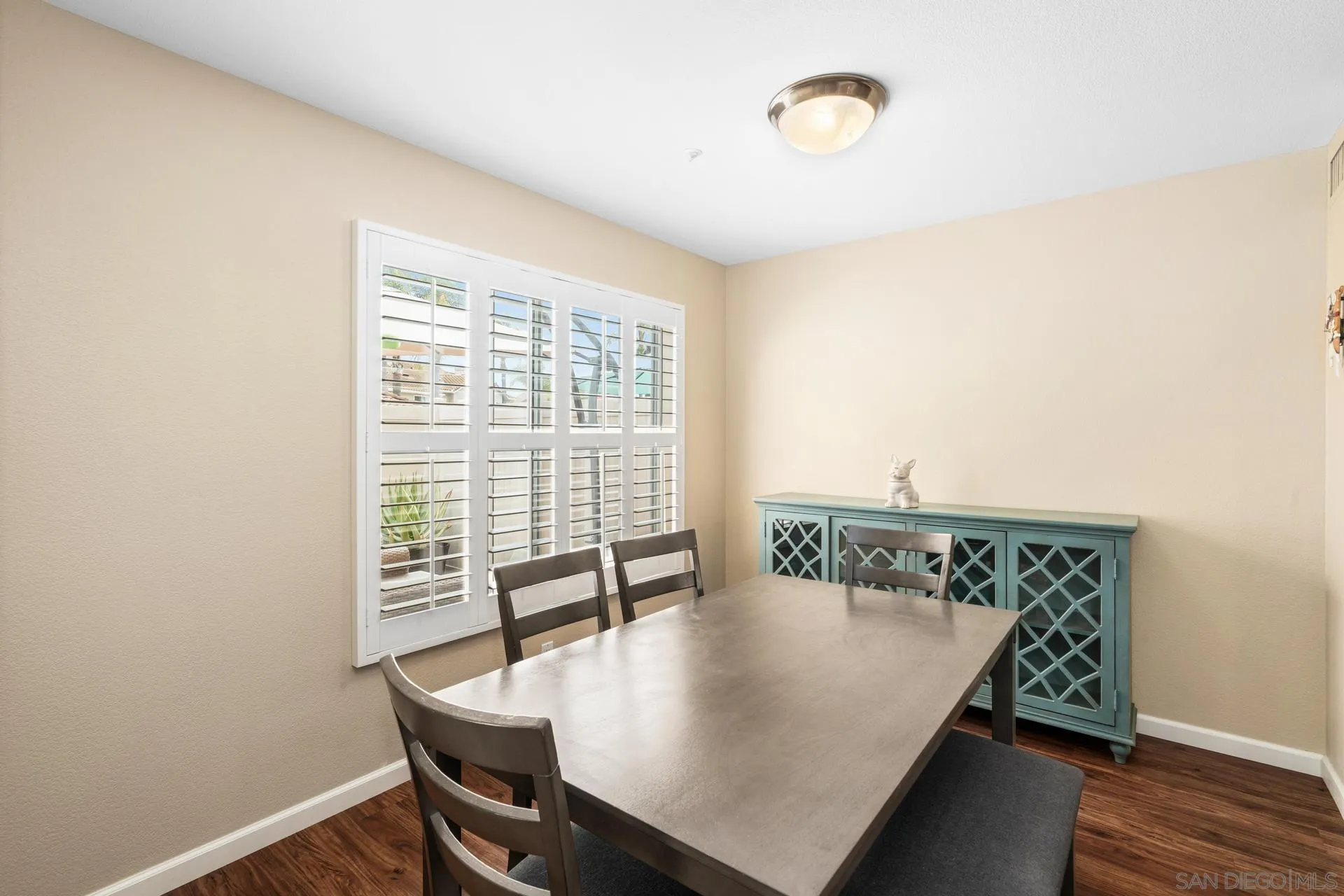 405 Whispering Willow Drive, Unit C Santee, CA 92071 - Photo 5 of 39 a view of a dining room with furniture and a window