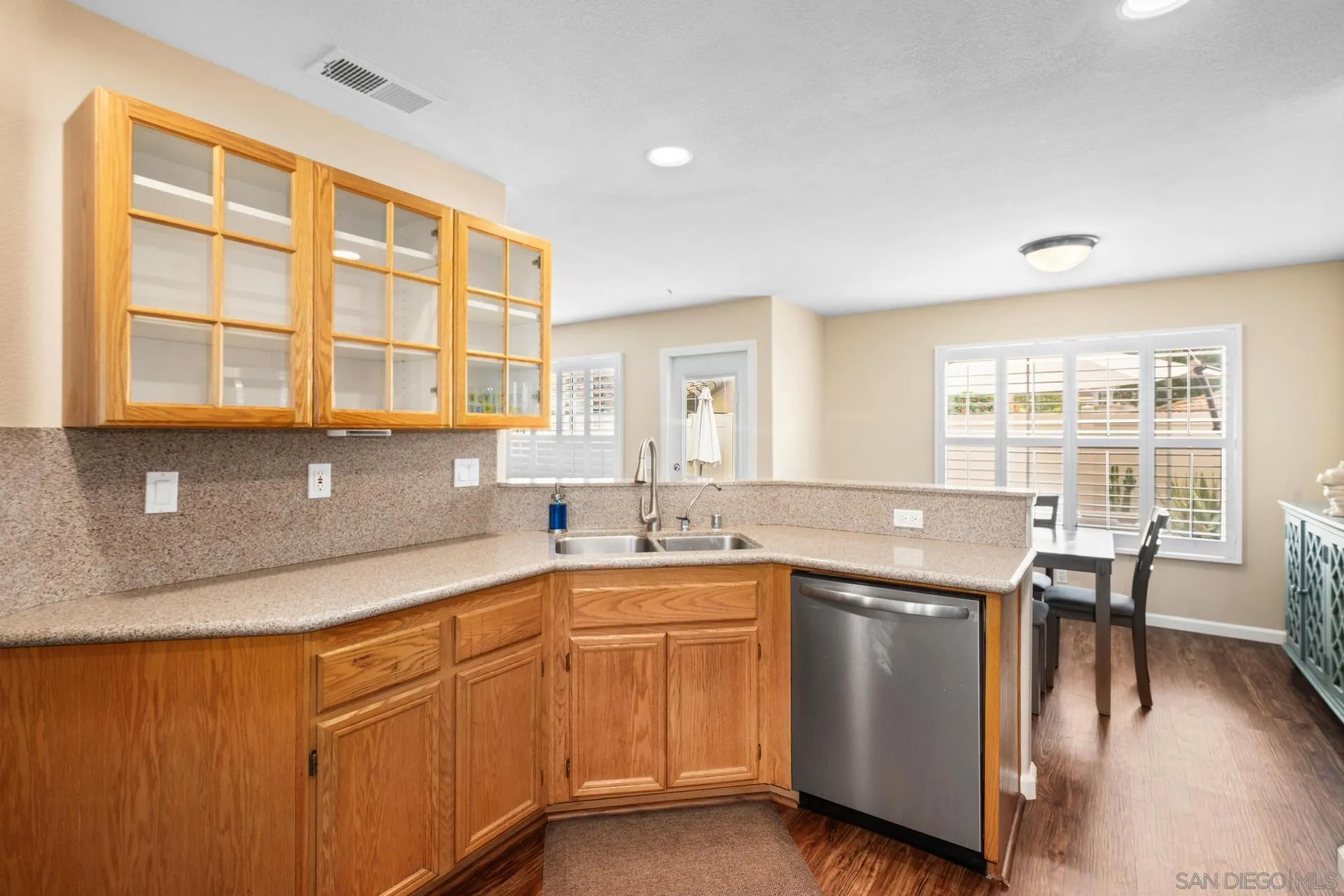 405 Whispering Willow Drive, Unit C Santee, CA 92071 - Photo 8 of 39 a kitchen with a sink stove and cabinets