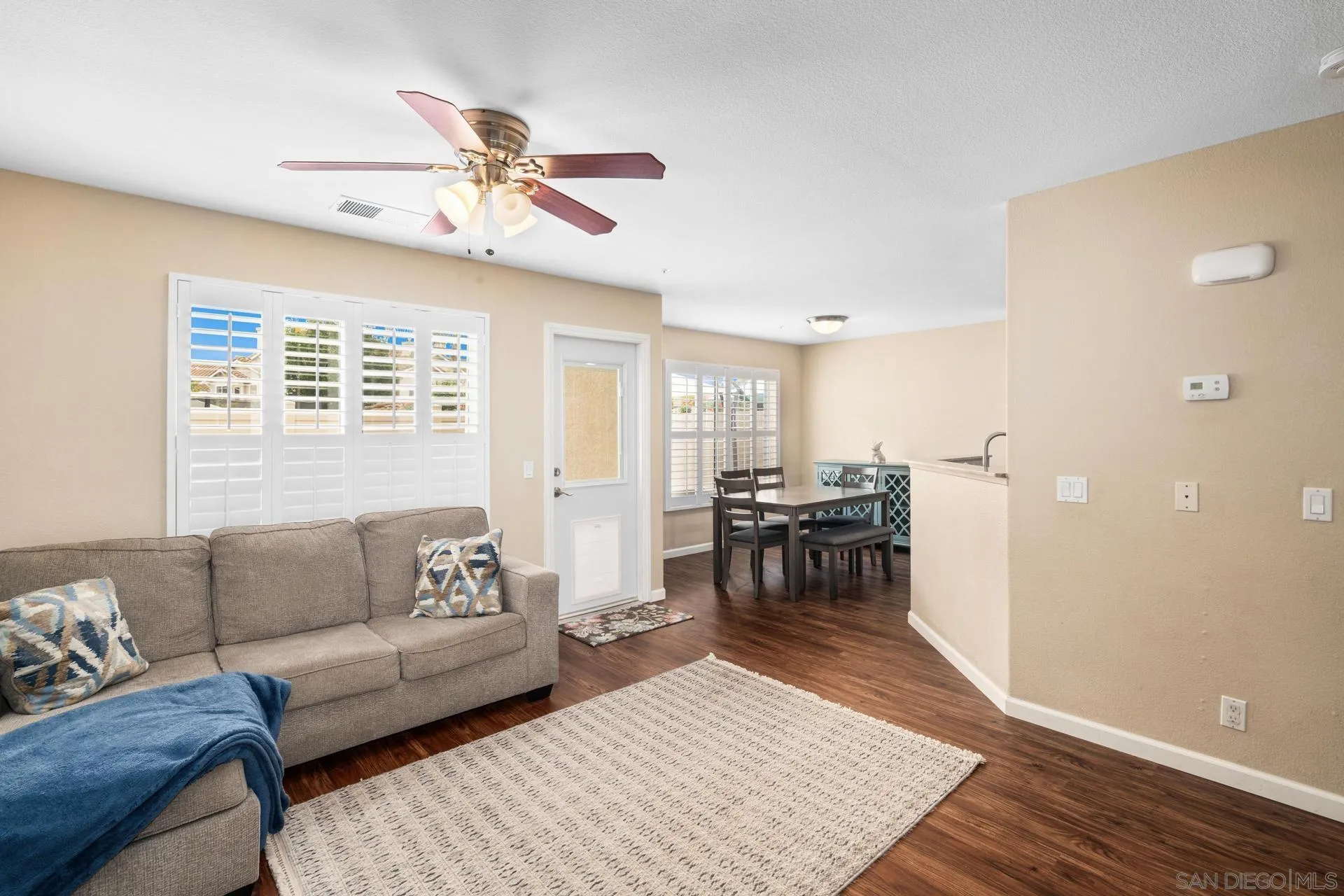 405 Whispering Willow Drive, Unit C Santee, CA 92071 - Photo 9 of 39 a living room with furniture and a window