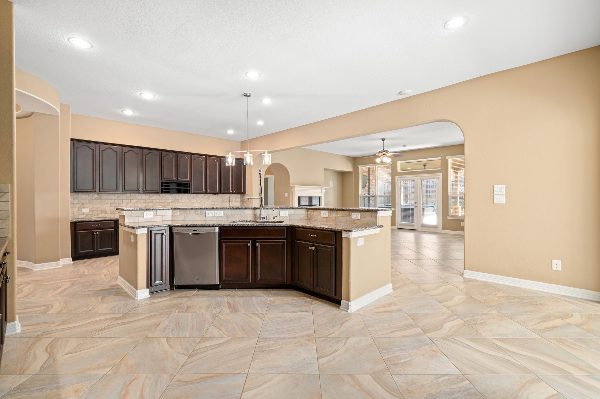 12514 Randy Riley Way Tomball, TX 77377 - Photo 14 of 44 a large kitchen with a large counter top a sink stainless steel appliances and cabinets