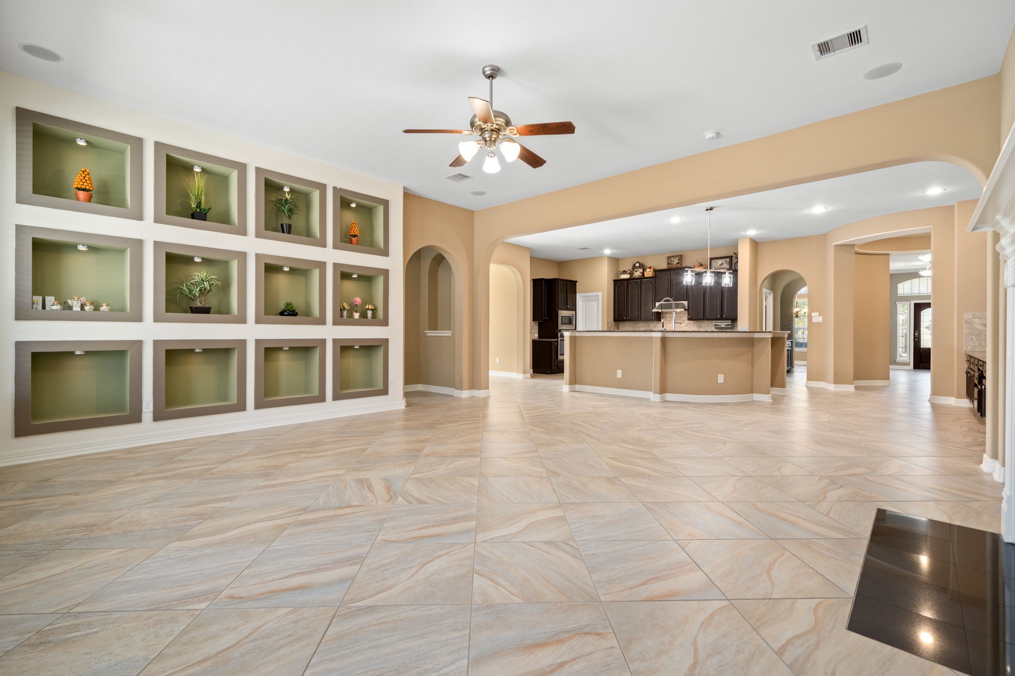 12514 Randy Riley Way Tomball, TX 77377 - Photo 19 of 44 a view of an empty room with kitchen and a window