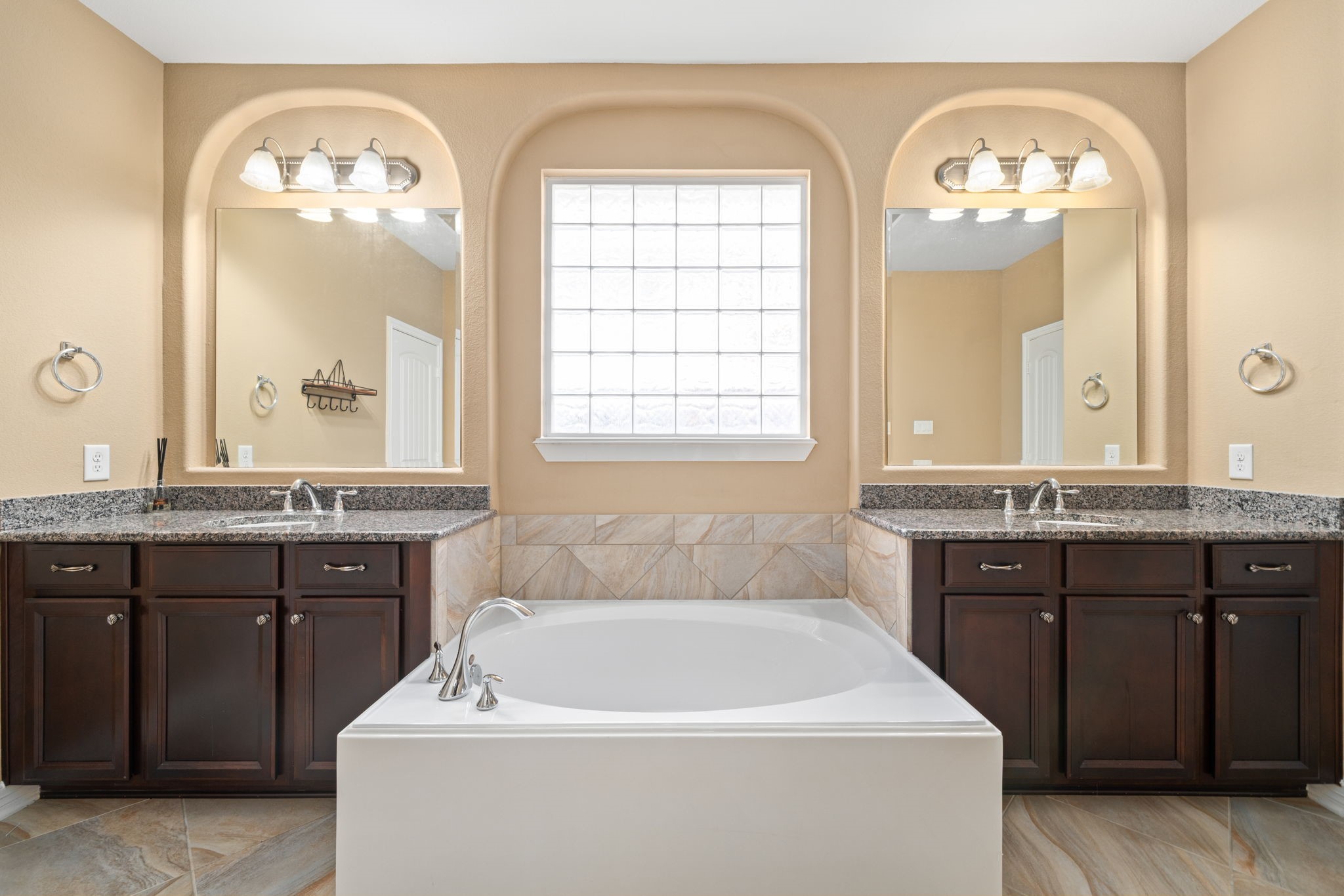 12514 Randy Riley Way Tomball, TX 77377 - Photo 23 of 44 a spacious bathroom with a granite countertop tub a sink and a large mirror
