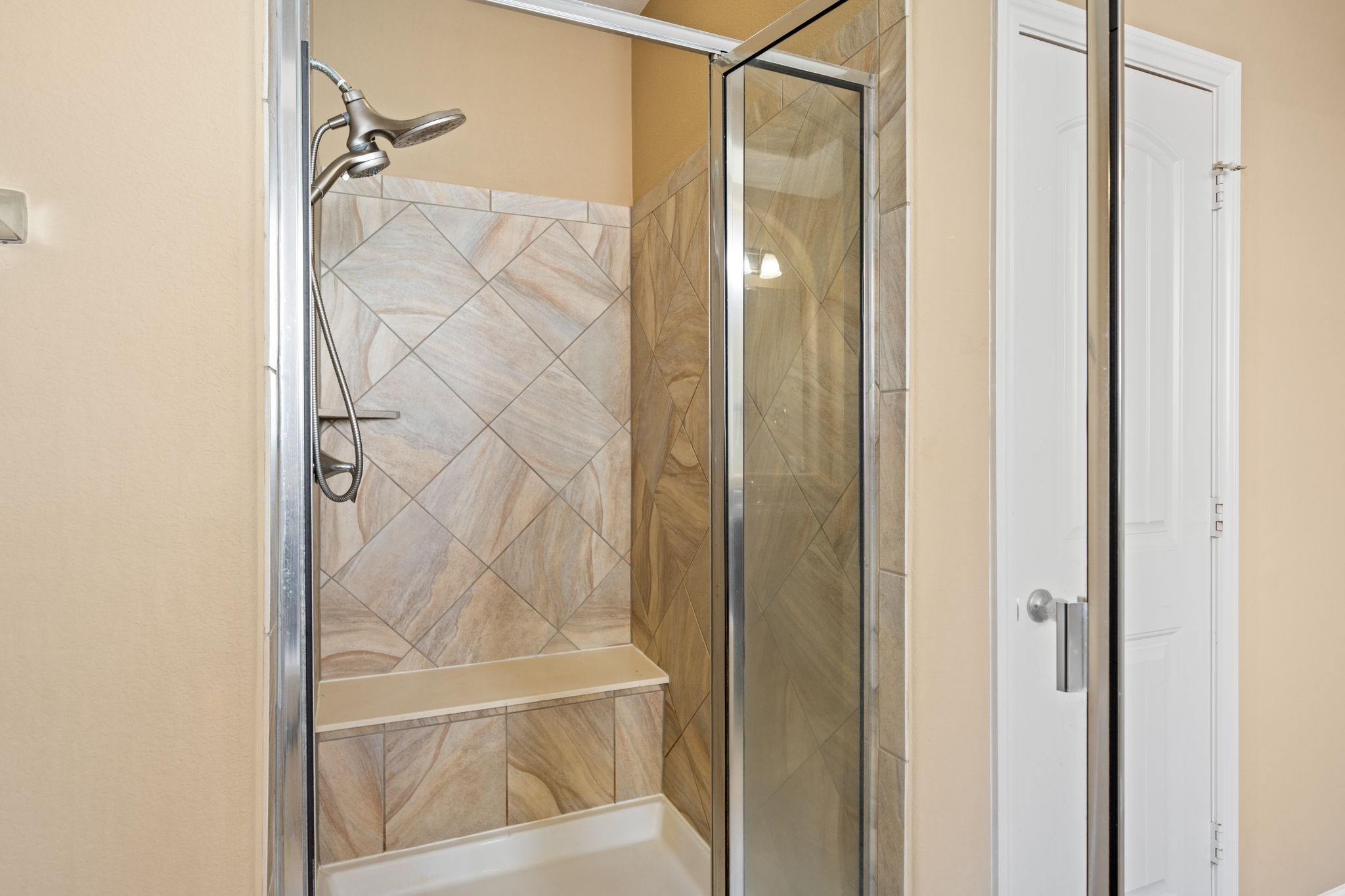 12514 Randy Riley Way Tomball, TX 77377 - Photo 24 of 44 a bathroom with a glass shower door