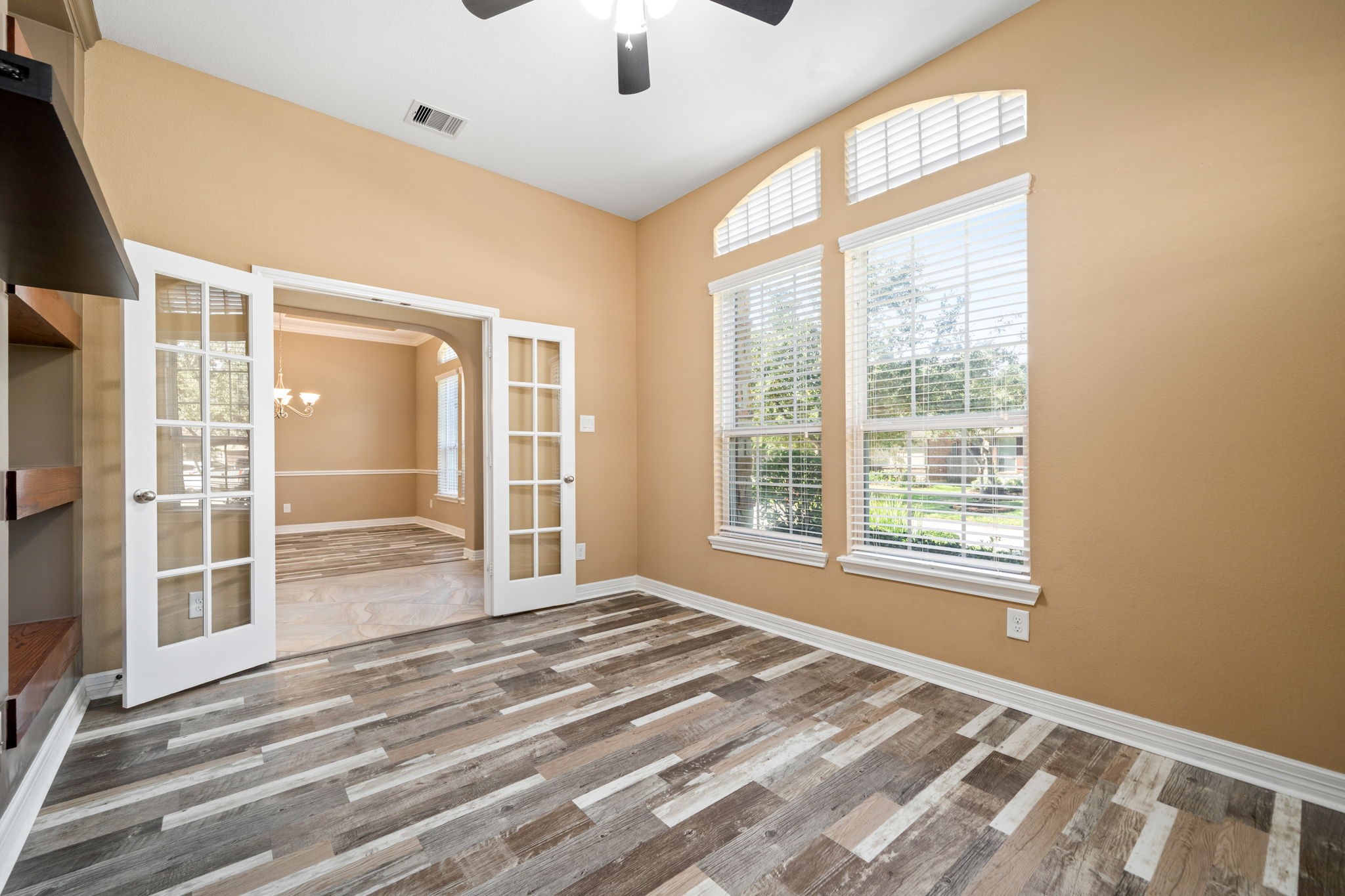 12514 Randy Riley Way Tomball, TX 77377 - Photo 9 of 44 a view of an empty room with a window and hardwood floor