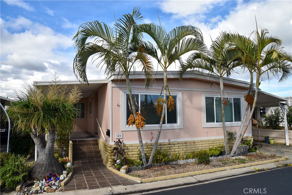 a view of a house with a yard and garage