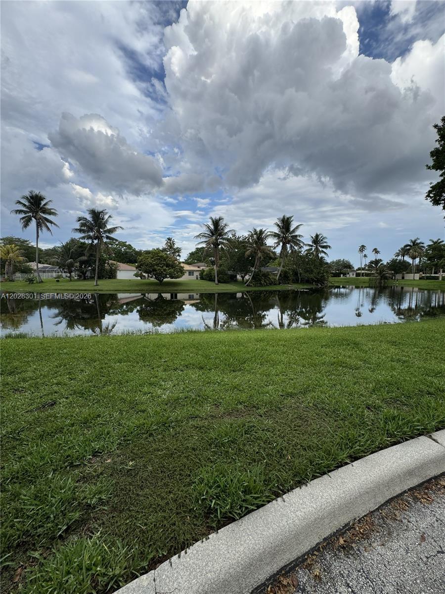 2021 Renaissance Boulevard, Unit 201 Miramar, FL 33025 - Photo 22 of 26 a view of a lake with houses