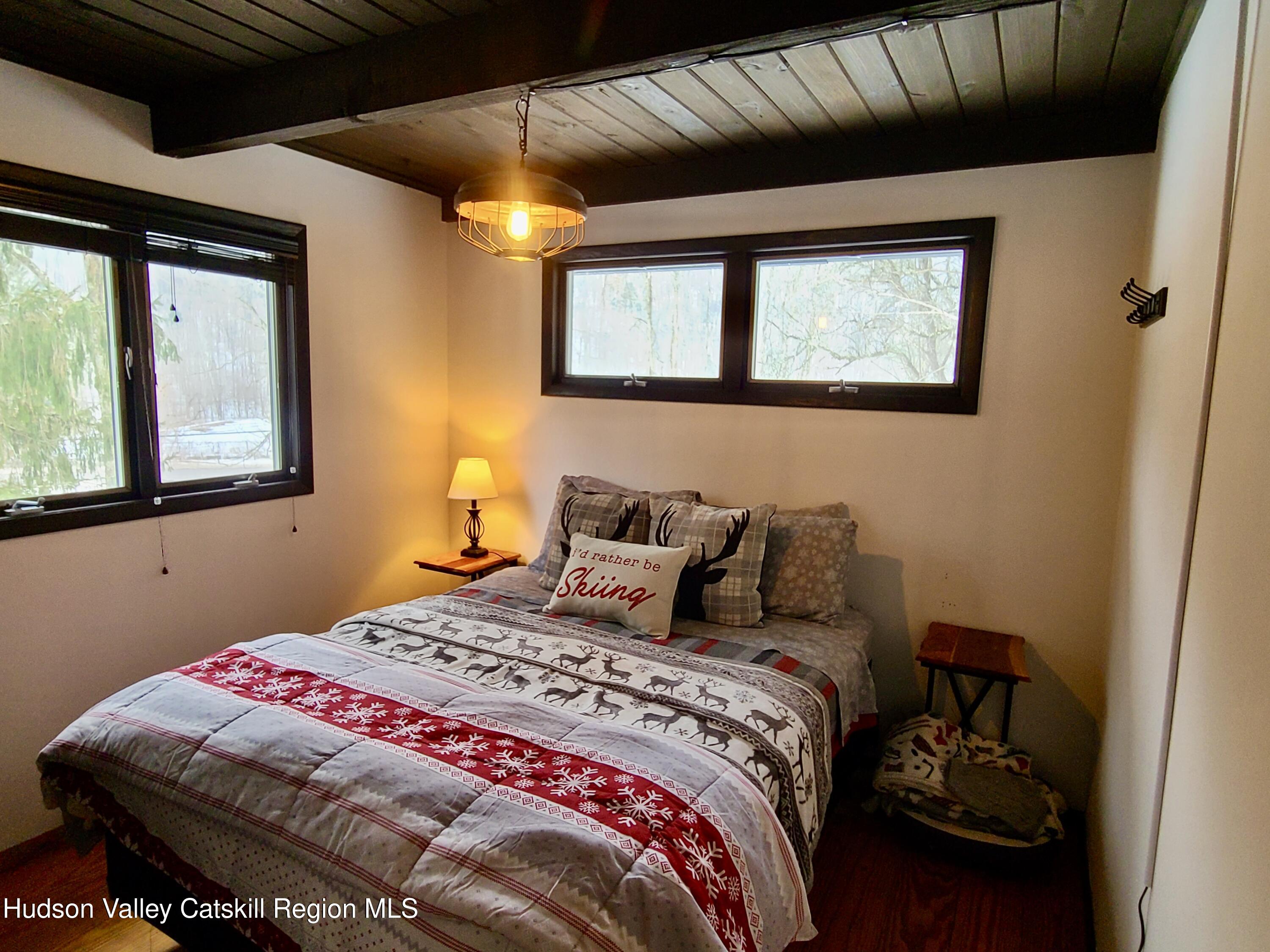 11 Rose Mountain Road Pine Hill, NY 12465 - Photo 14 of 26 a bedroom with a bed and a window
