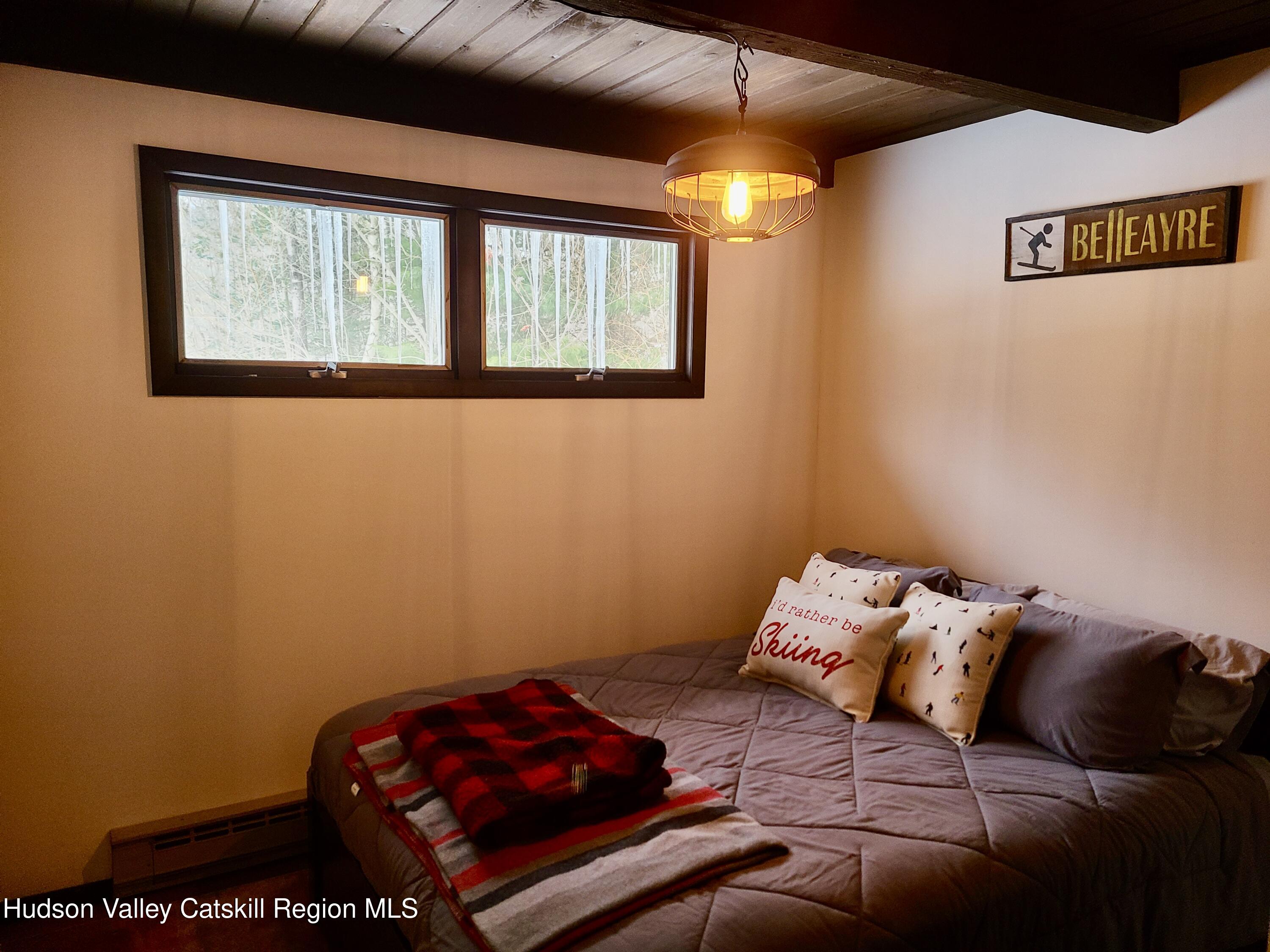 11 Rose Mountain Road Pine Hill, NY 12465 - Photo 17 of 26 a bedroom with bed and a window