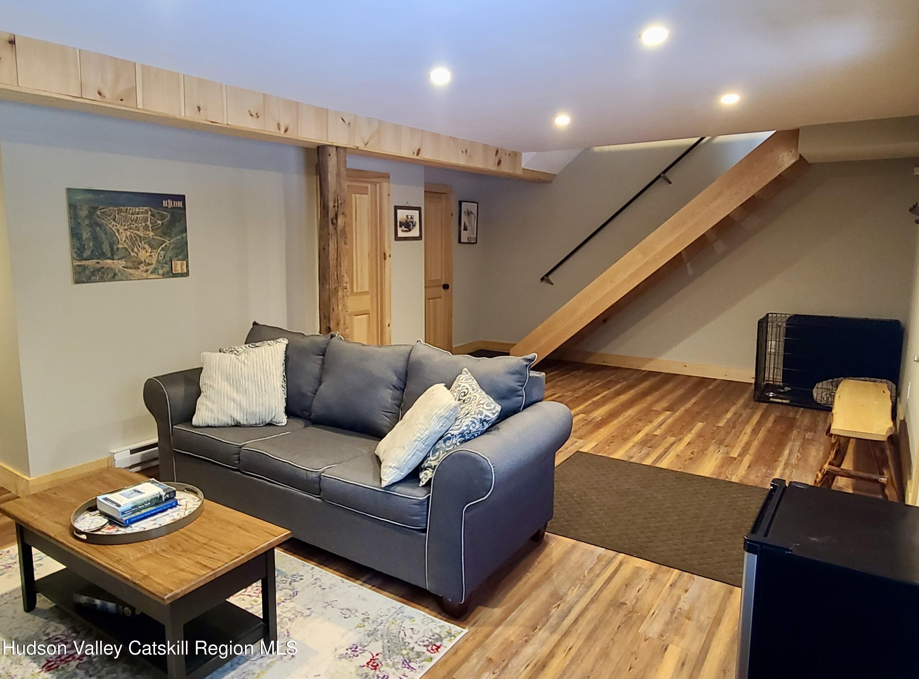 11 Rose Mountain Road Pine Hill, NY 12465 - Photo 8 of 26 a living room with furniture and a wooden floor