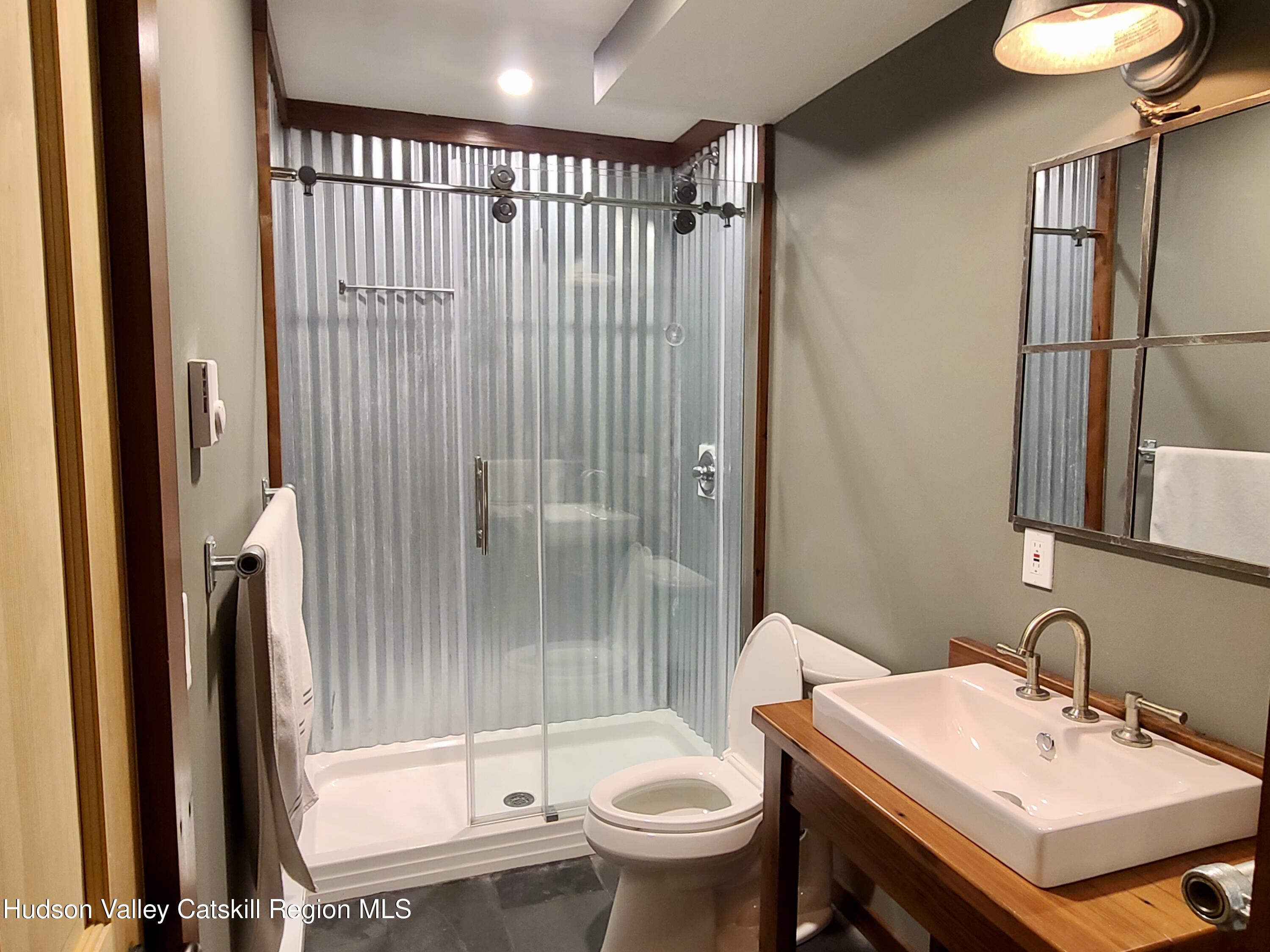 11 Rose Mountain Road Pine Hill, NY 12465 - Photo 9 of 26 a bathroom with a sink toilet and shower