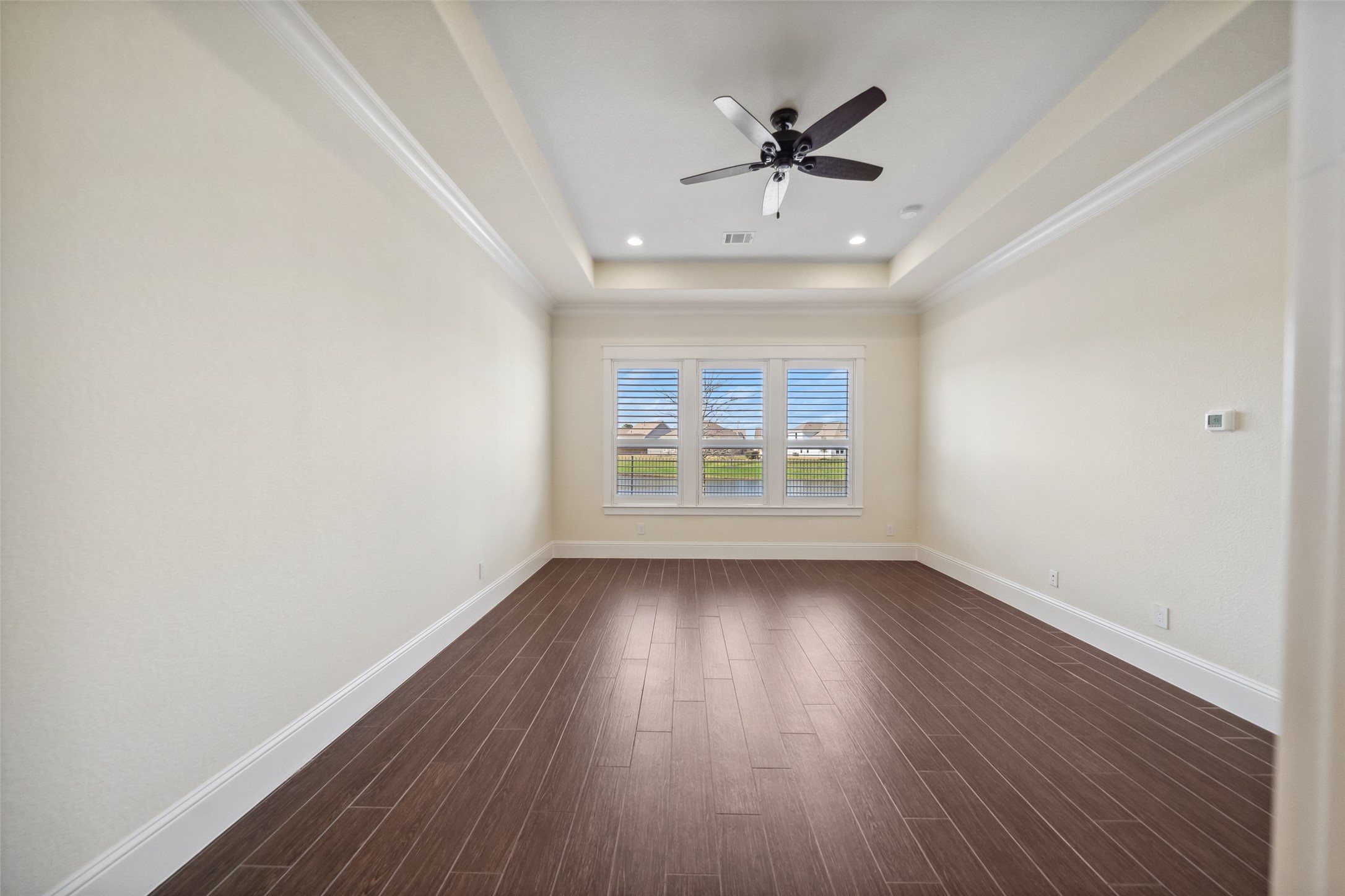 2149 Rope Maker Road Conroe, TX 77384 - Photo 12 of 45 wooden floor in an empty room with a window