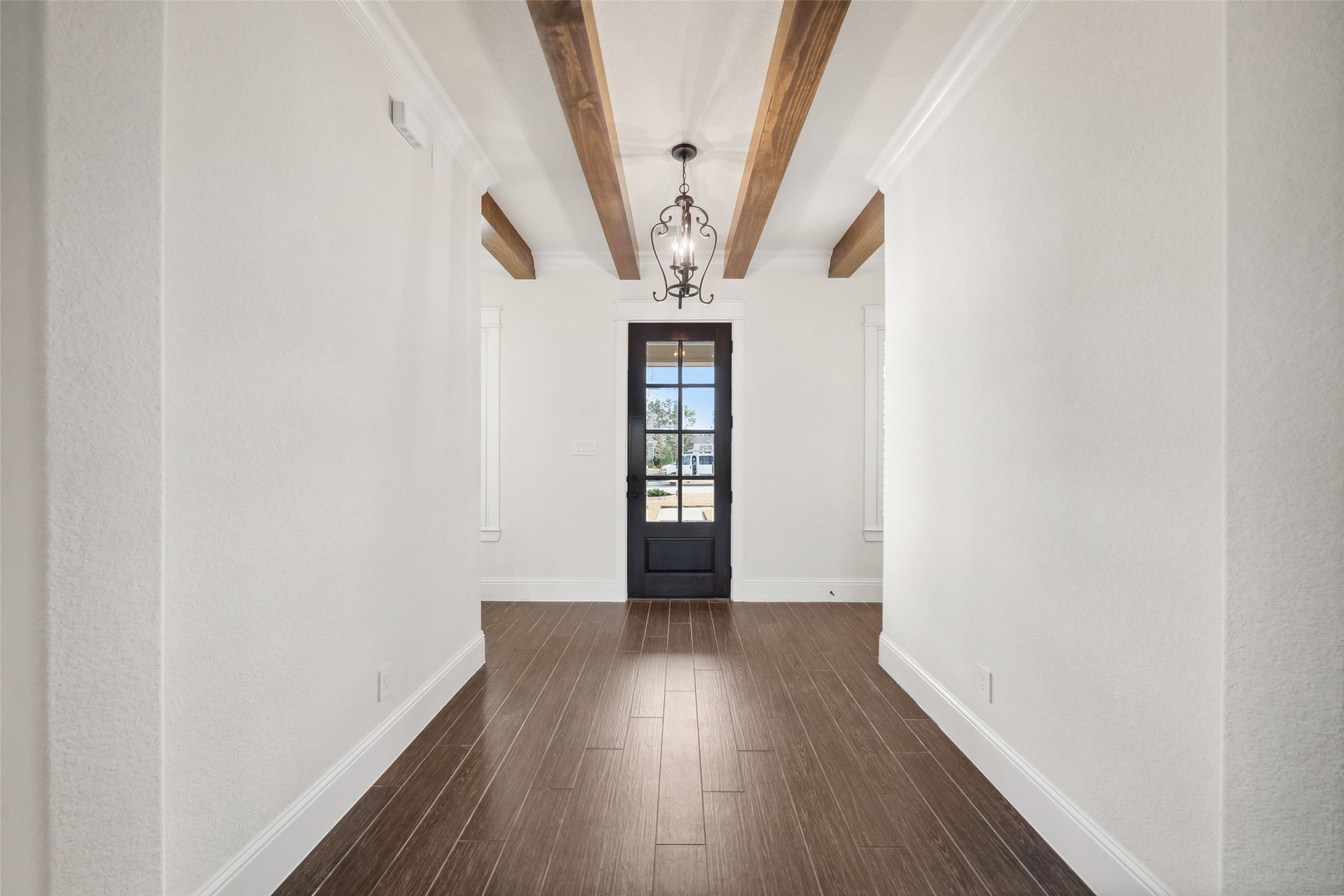 2149 Rope Maker Road Conroe, TX 77384 - Photo 2 of 45 a view of an empty room with wooden floor and a window
