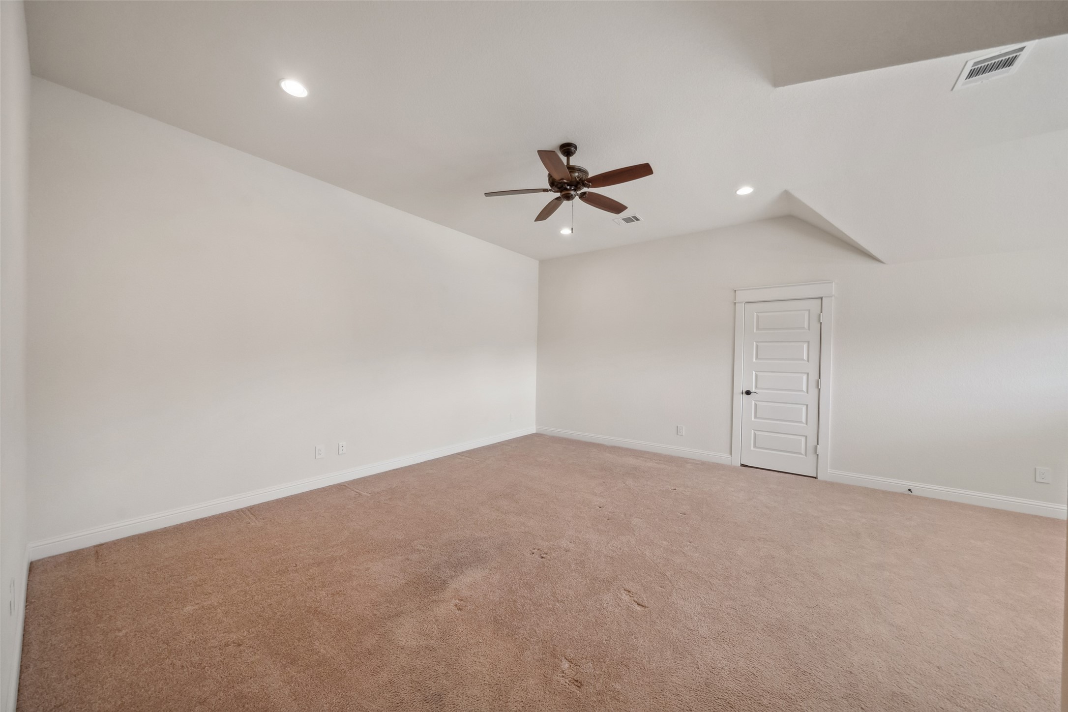 2149 Rope Maker Road Conroe, TX 77384 - Photo 22 of 45 an empty room with a ceiling fan and a window