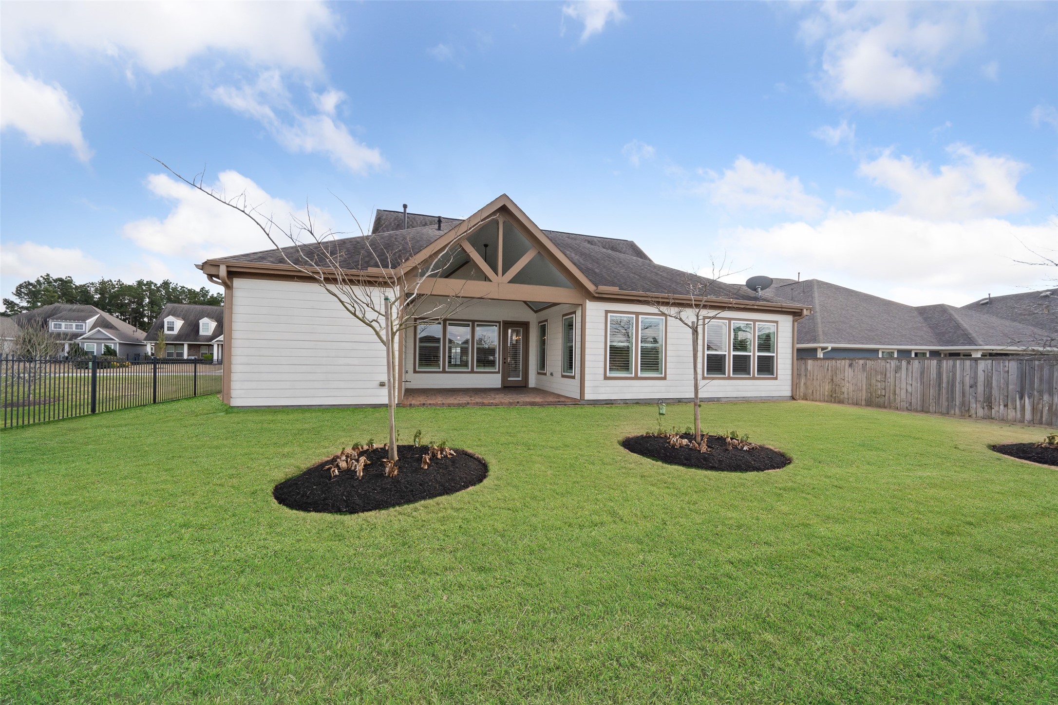2149 Rope Maker Road Conroe, TX 77384 - Photo 24 of 45 a front view of a house with a garden