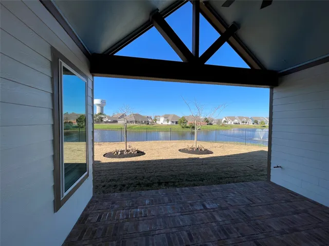 a room with pool table and outdoor seating