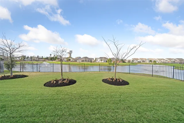 a view of a lake with a yard