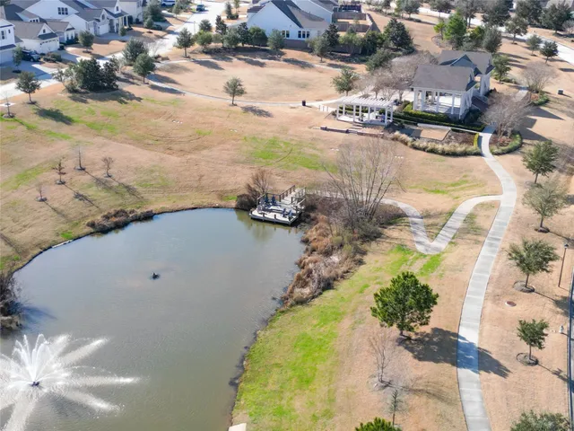 an aerial view of a house with a yard basket ball court and outdoor seating