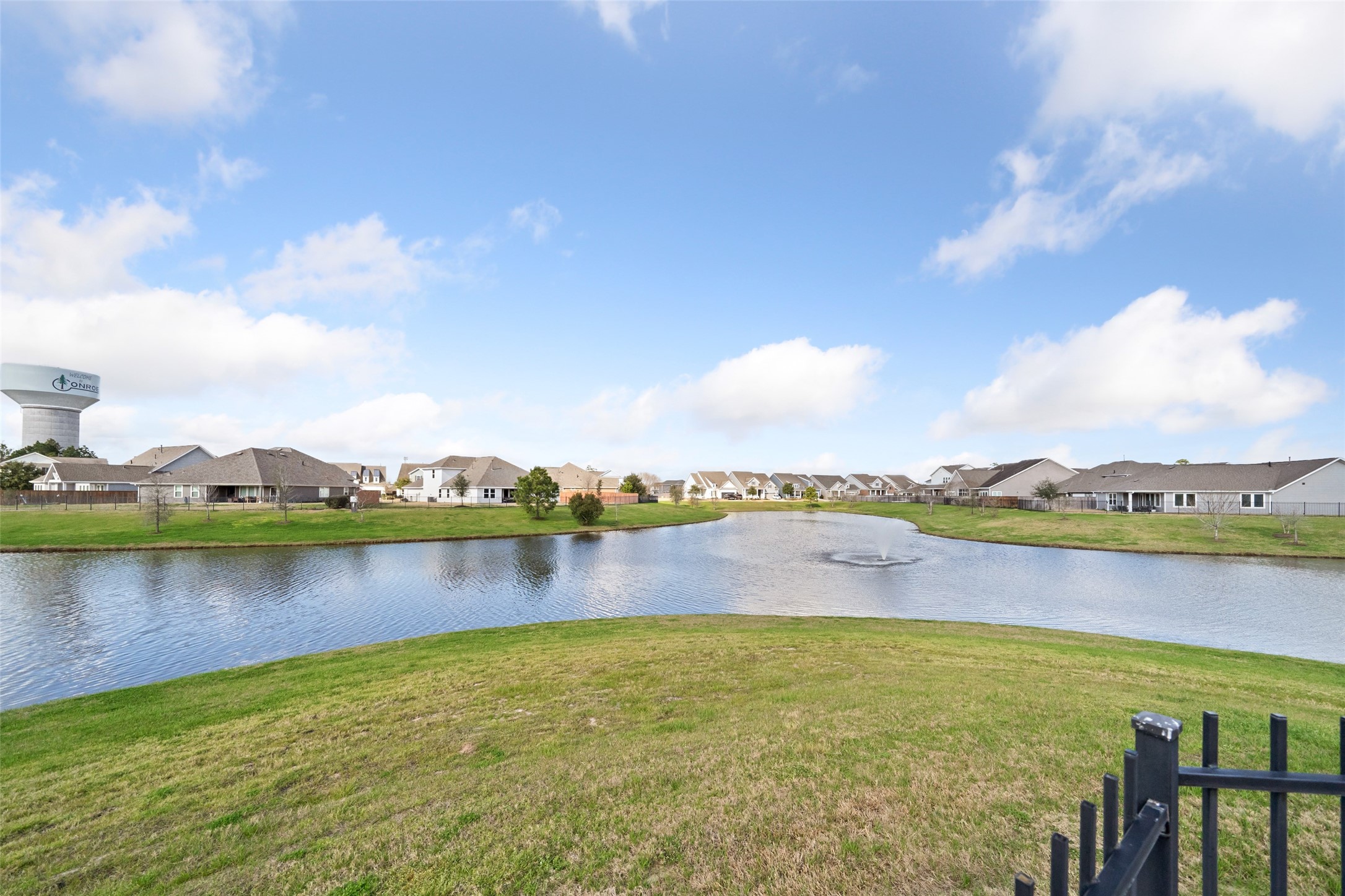 2149 Rope Maker Road Conroe, TX 77384 - Photo 43 of 45 a view of a lake with houses in the back