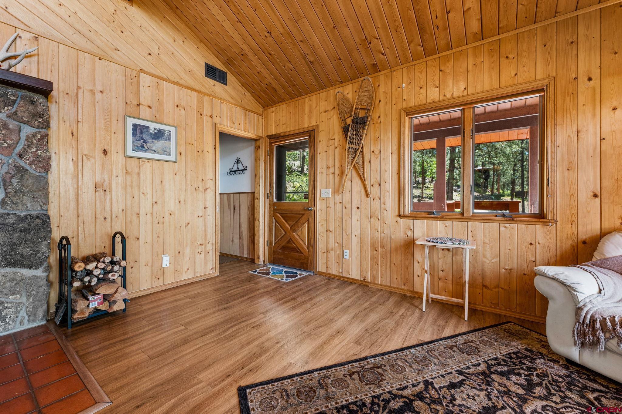 1024 Deer Ridge Drive Bayfield, CO 81122 - Photo 8 of 45 a view of a room with wooden floor and windows