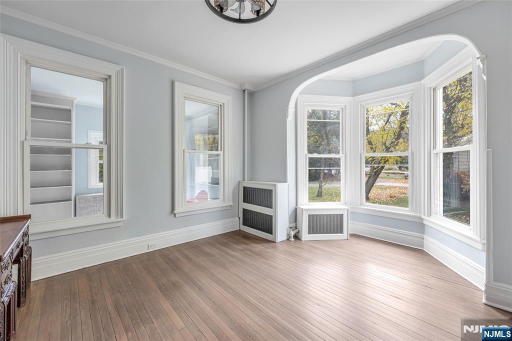 684 Closter Dock Road Closter, NJ 07624 - Photo 15 of 30 a view of an empty room with wooden floor and a window
