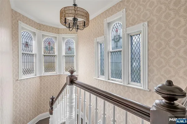 a bedroom with bed and windows