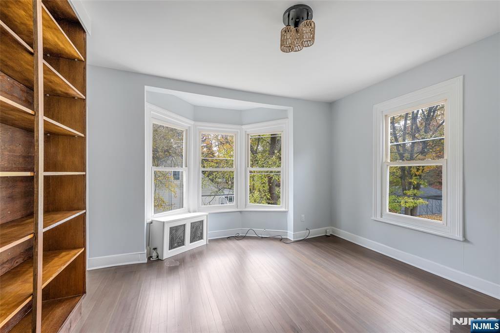 684 Closter Dock Road Closter, NJ 07624 - Photo 21 of 30 wooden floor in an empty room with a window